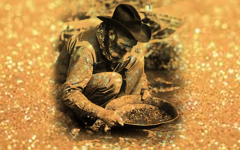Photo of a gold miner looking for gold