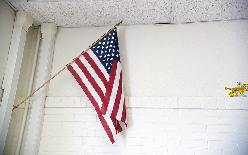 Photo of an American flag in a classroom