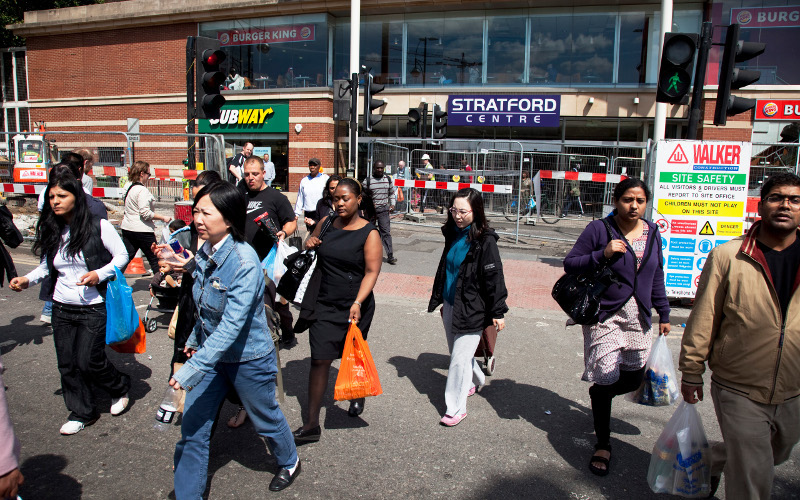 Photo of people of different ethnic origin leaving a shopping centre in London